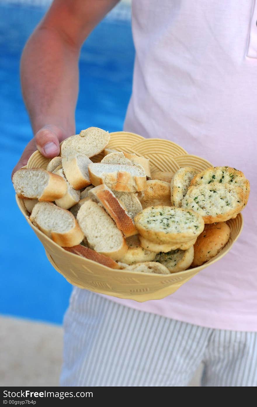 A bread basket filled with bread varieties. A bread basket filled with bread varieties