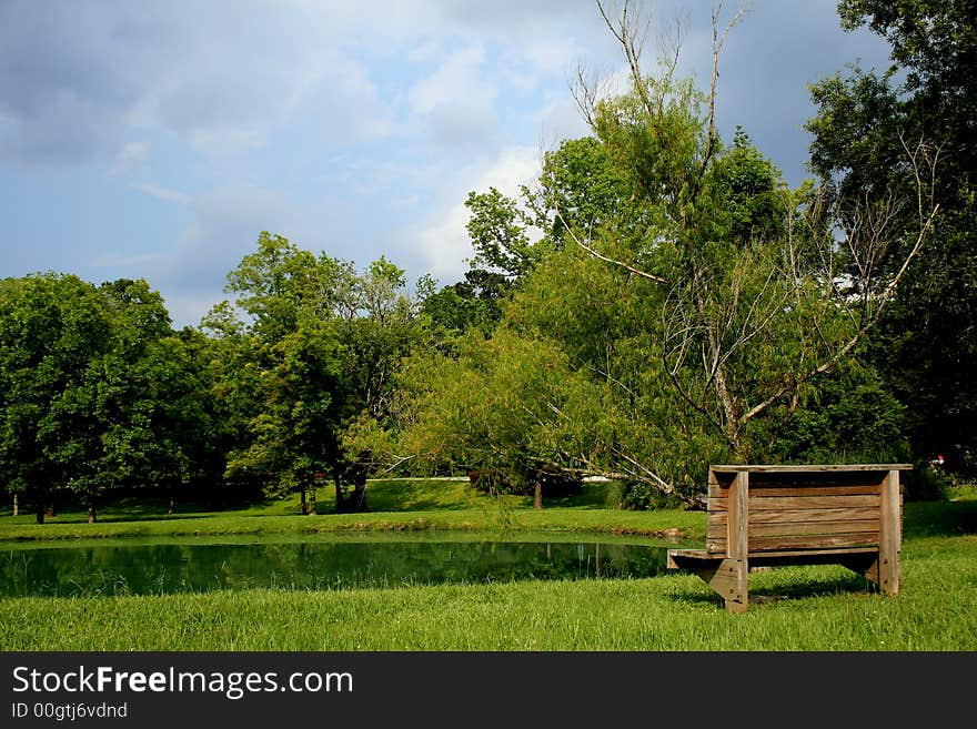 Bench On Side Of Pond