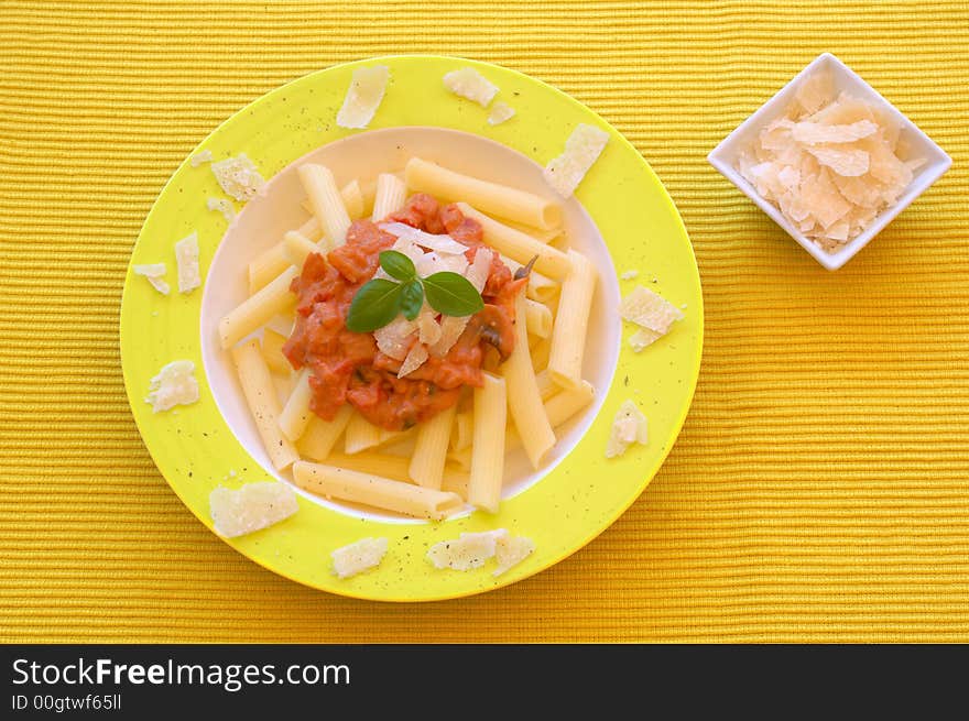 Healthy pasta garnished with parmesan, pepper and basil.