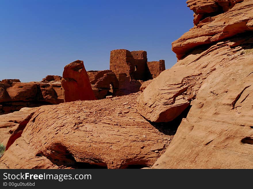 The red rocks on the Wukoki indian pueblo ruins against a blue Arizona sky in Wupatki National Monument