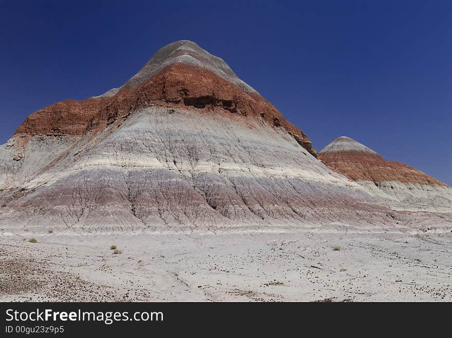 Tepee hill formats against a blue Arizona sky in the Petrified Forest National Park. Tepee hill formats against a blue Arizona sky in the Petrified Forest National Park