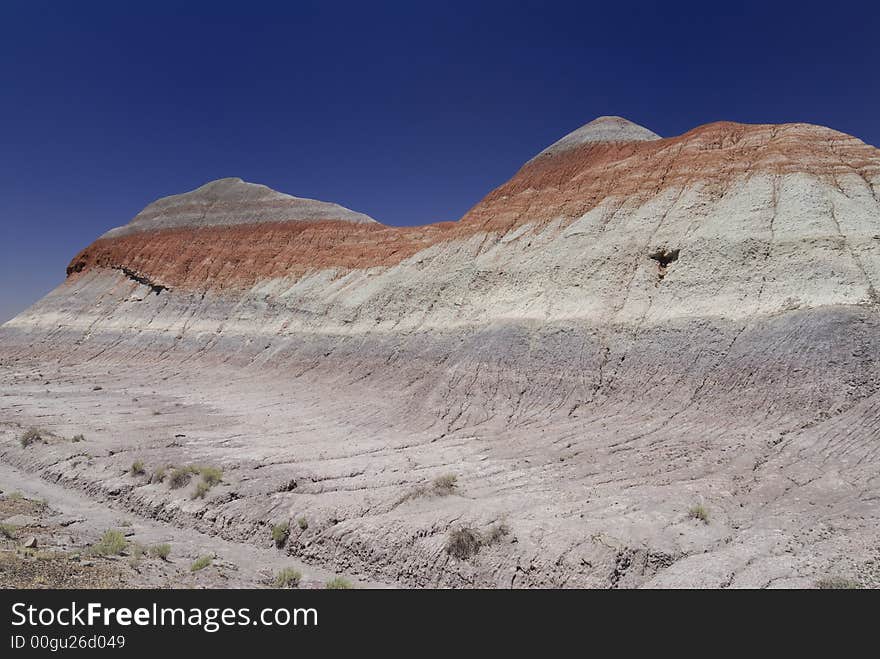 Tepee hill formats against a blue Arizona sky in the Petrified Forest National Park. Tepee hill formats against a blue Arizona sky in the Petrified Forest National Park