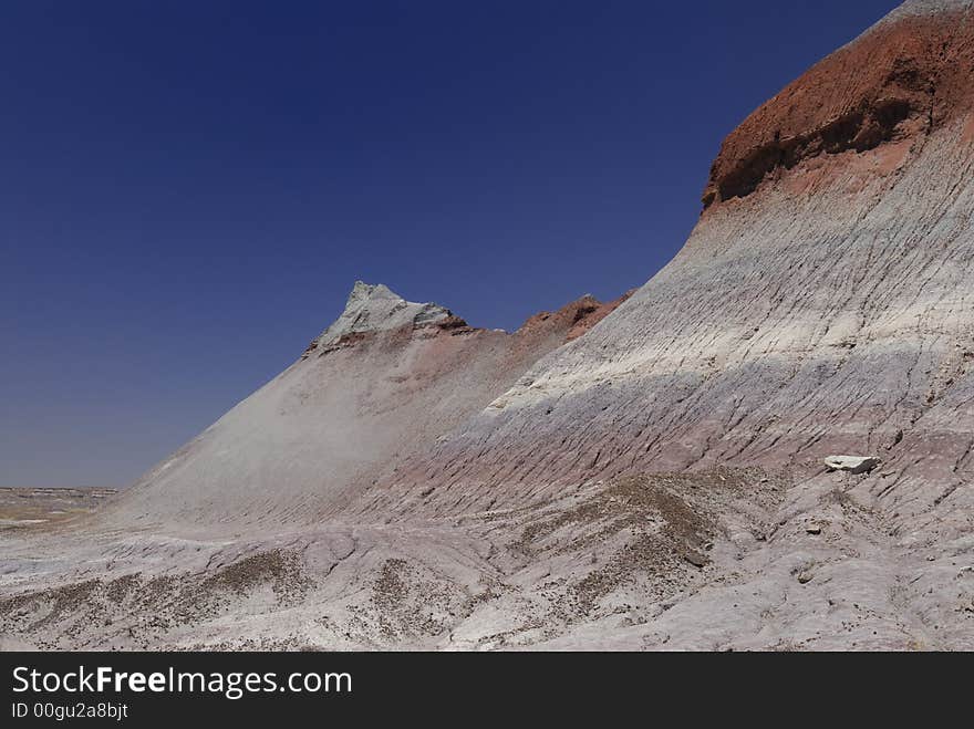 Tepee hill formats against a blue Arizona sky in the Petrified Forest National Park. Tepee hill formats against a blue Arizona sky in the Petrified Forest National Park