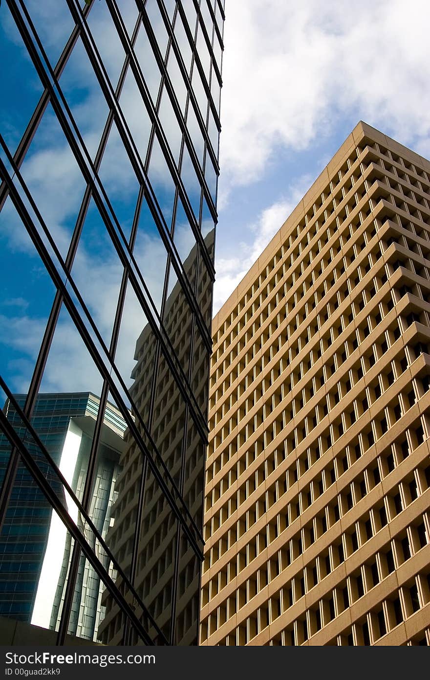 Reflections off a skyscraper building of other offices and the blue sky. Reflections off a skyscraper building of other offices and the blue sky