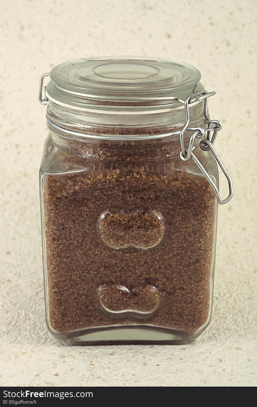 Close up of a kitchen jar with brown sugar. Close up of a kitchen jar with brown sugar