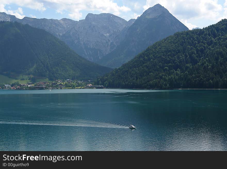 Achensee Austia , Lake in Alps , June 2007 . Small white Ship Not so far from Innsbruck . Achensee Austia , Lake in Alps , June 2007 . Small white Ship Not so far from Innsbruck .