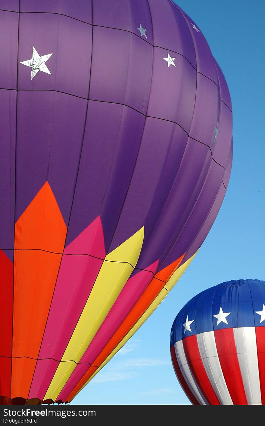 Colorful hot air balloons soaring in the blue summer sky