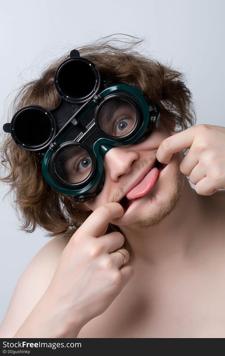 Farcical man wering welding glasses