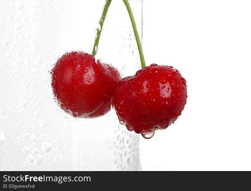 Fresh cup of cherries. white background