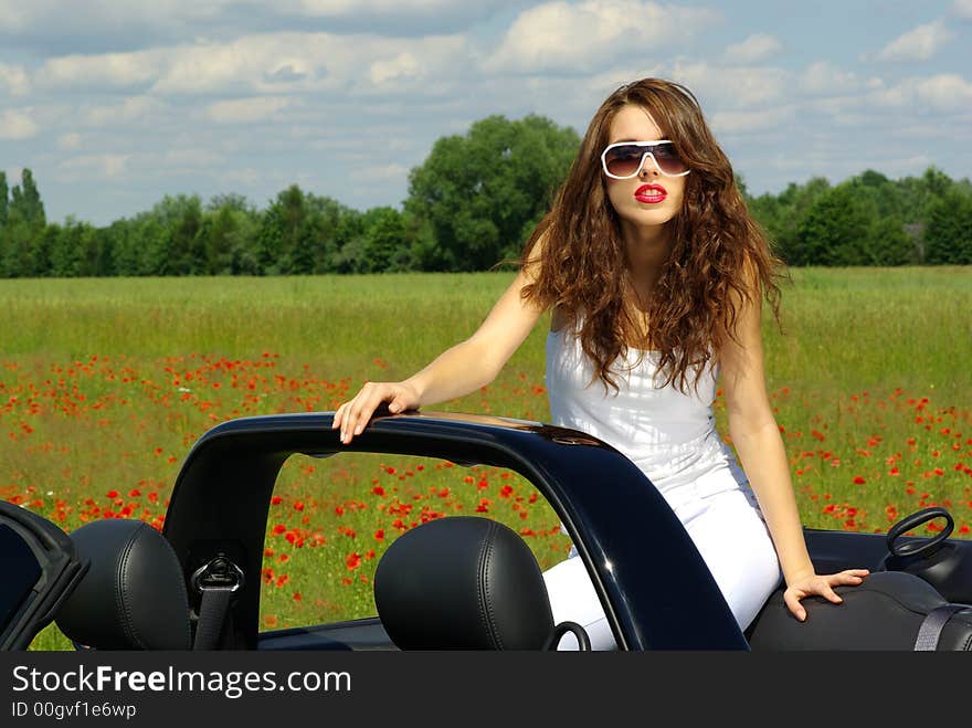 Beautiful girl look out from the cabrio. Beautiful girl look out from the cabrio