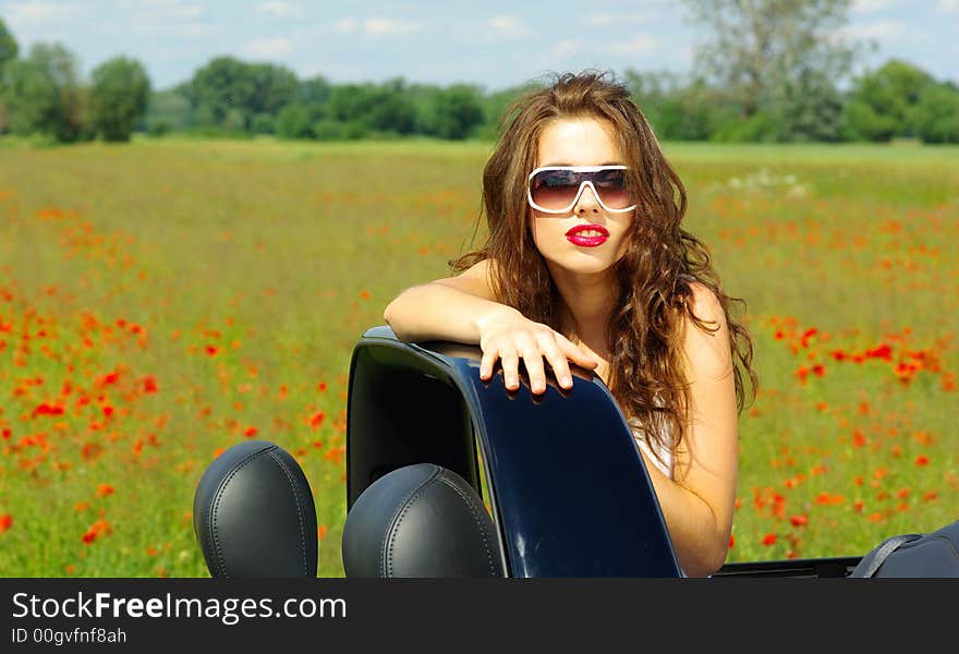 Beautiful girl look out from the cabrio. Beautiful girl look out from the cabrio