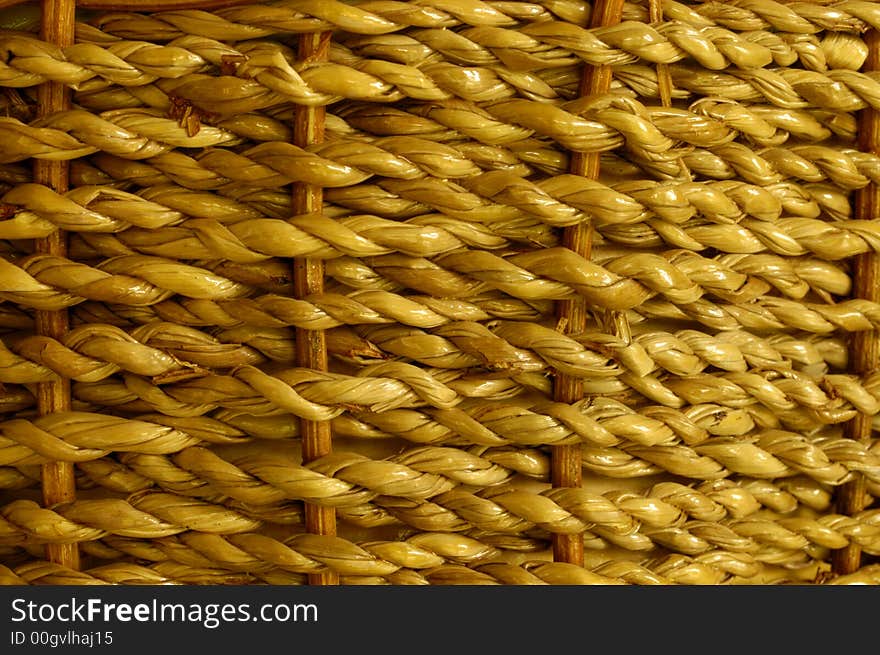 Stock macro photo of the texture of a basket woven from grass cord. The basket is wet and shiny. Useful for layer masks or as a patterned background. Focus falls off at RH edge to give depth to the image. Stock macro photo of the texture of a basket woven from grass cord. The basket is wet and shiny. Useful for layer masks or as a patterned background. Focus falls off at RH edge to give depth to the image.