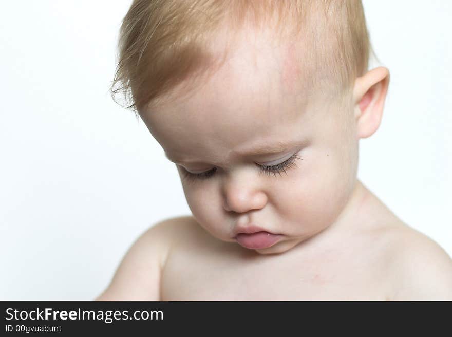 Image of beautiful toddler looking down