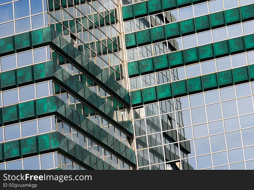 Office center building with reflectvie green windows