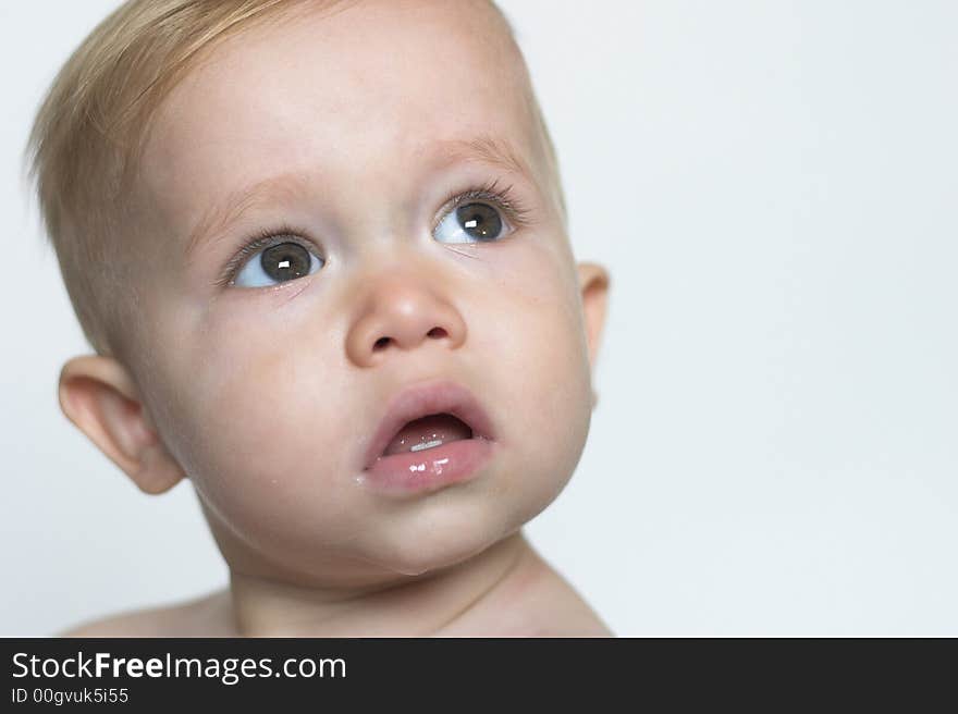 Image of beautiful toddler with a serious look on his face. Image of beautiful toddler with a serious look on his face