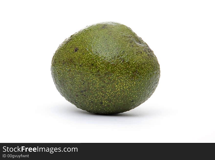 A single whole avocado pear on a white background