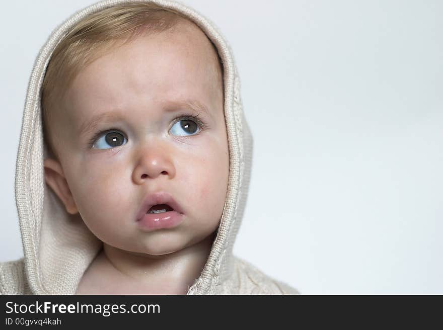 Image of beautiful toddler wearing a hooded sweater. Image of beautiful toddler wearing a hooded sweater