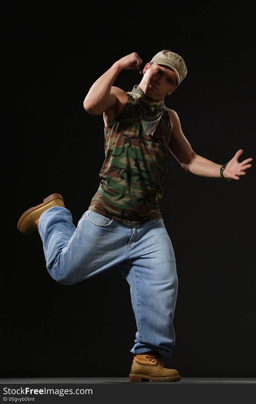 Krump style dancer jumping on leg. Krump style dancer jumping on leg