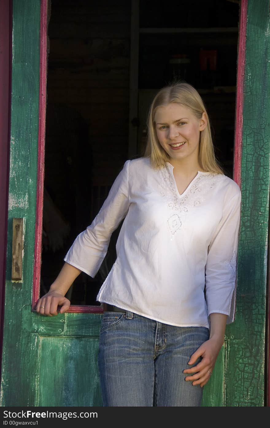 Blond girl in doorway