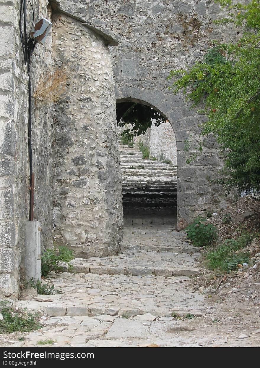 Old stone arch and stairs in ancient castle