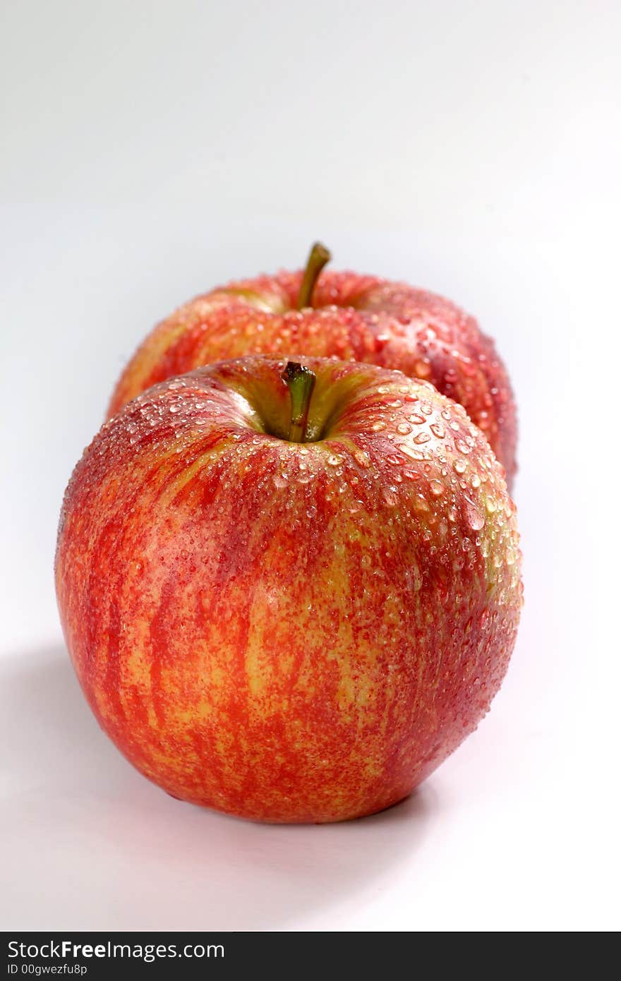 Fullview of fresh couple apple on the white background