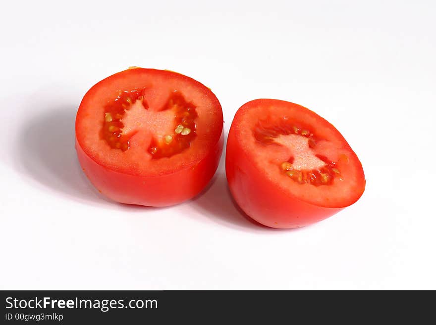 Full view of fresh tomato slices on the white background