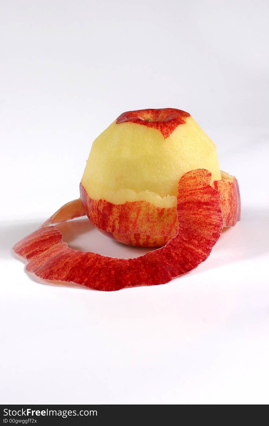 Fullview of fresh apple with its peel on the white background