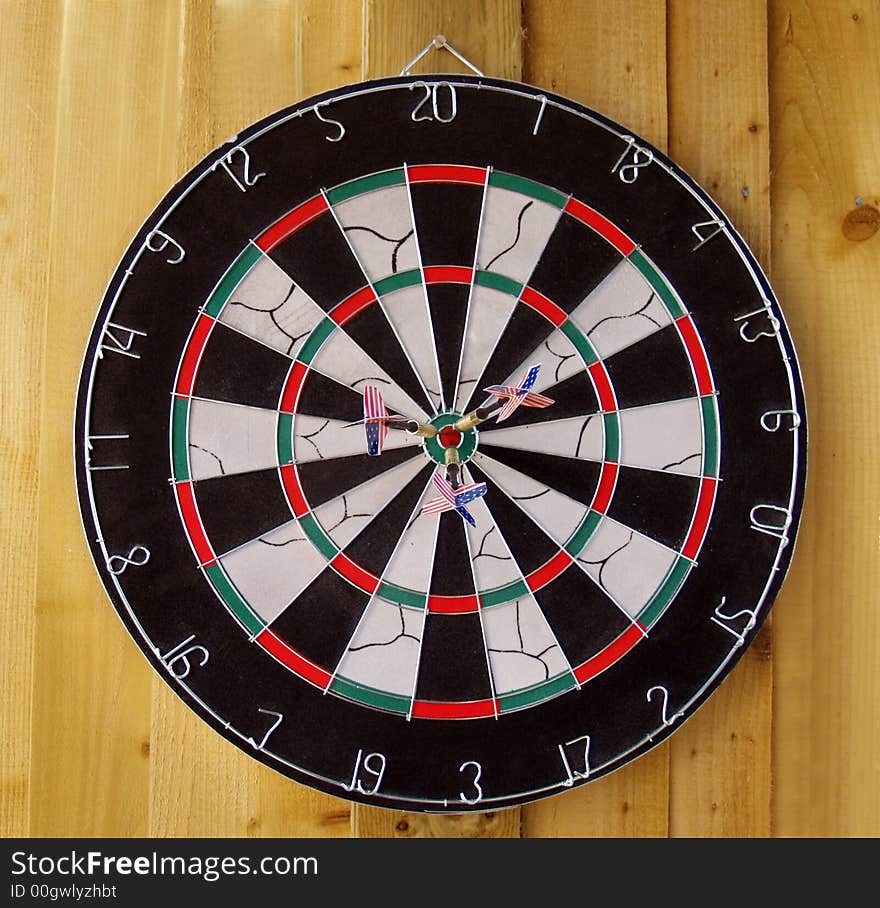 Dartboard with three bulls with USA  flights. Dartboard with three bulls with USA  flights