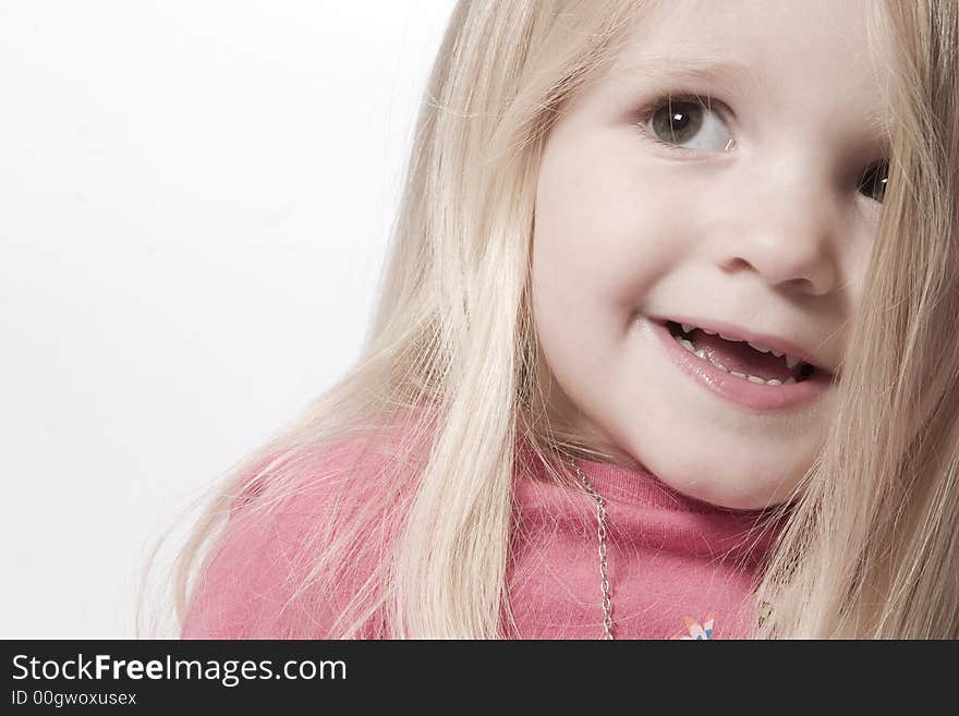 Little children portraits taken in the studio on a white background. Little children portraits taken in the studio on a white background