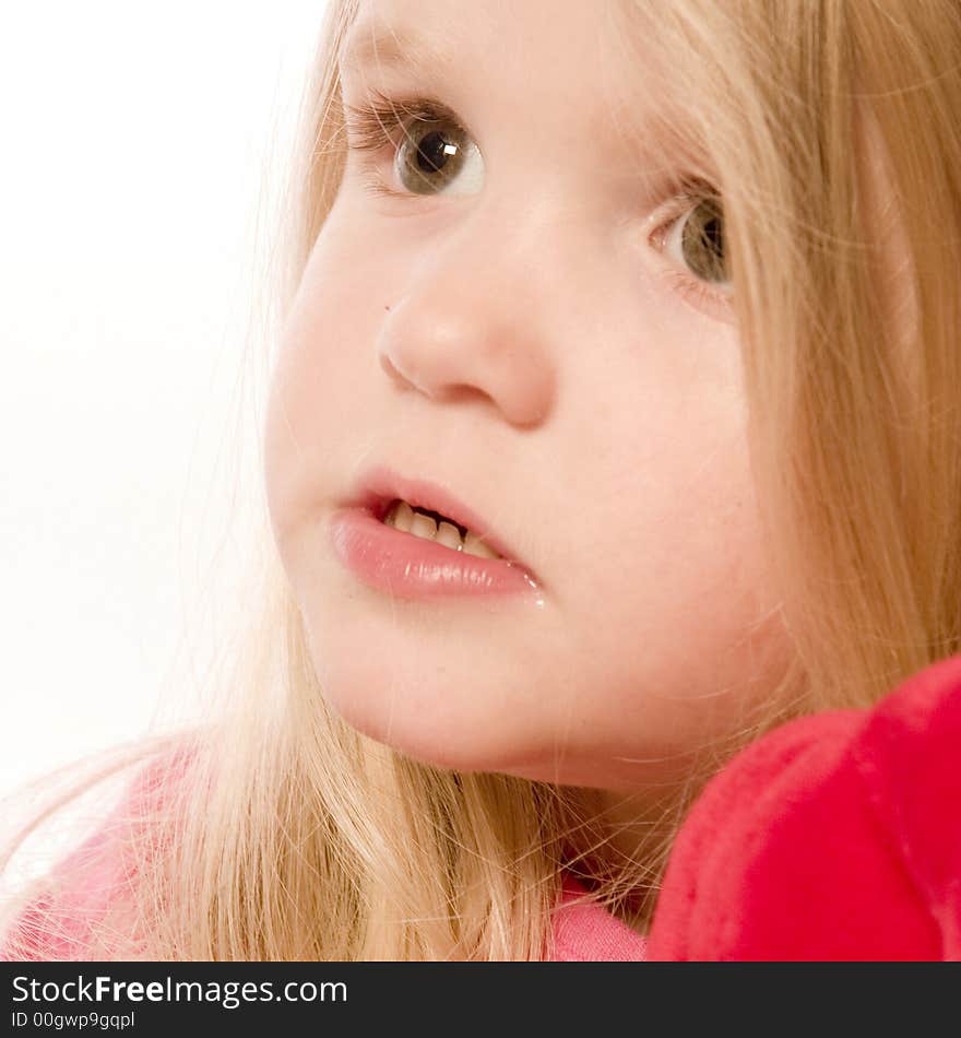 Little children portraits taken in the studio on a white background. Little children portraits taken in the studio on a white background