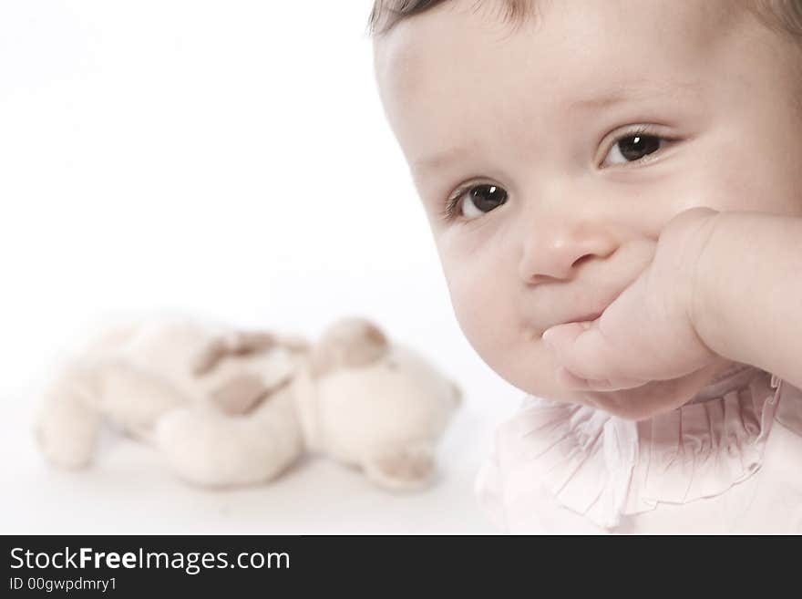 Little children portraits taken in the studio on a white background. Little children portraits taken in the studio on a white background