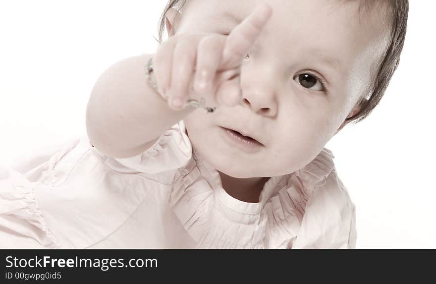 Little children portraits taken in the studio on a white background. Little children portraits taken in the studio on a white background