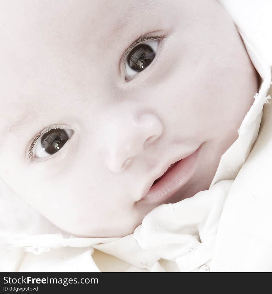 Little children portraits taken in the studio on a white background. Little children portraits taken in the studio on a white background