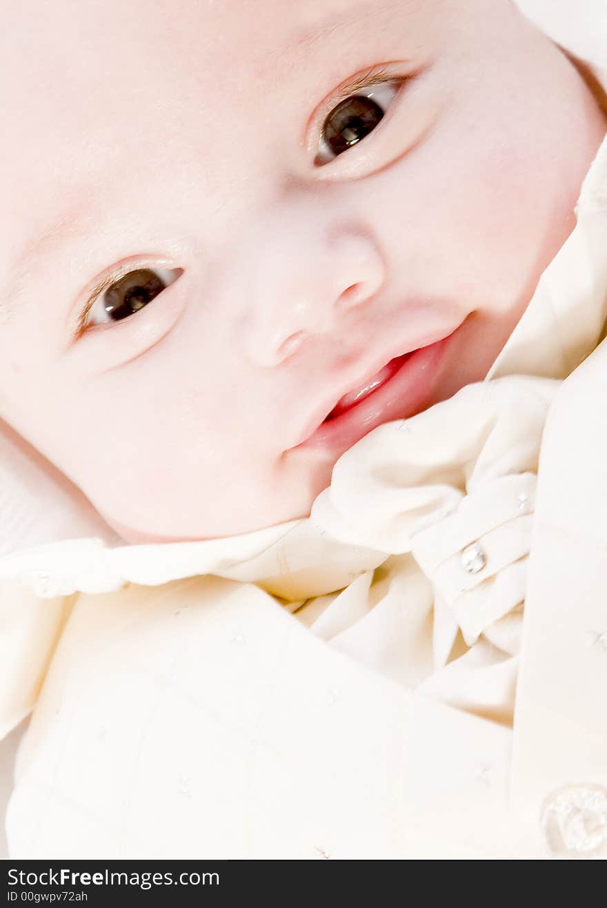 Little children portraits taken in the studio on a white background. Little children portraits taken in the studio on a white background