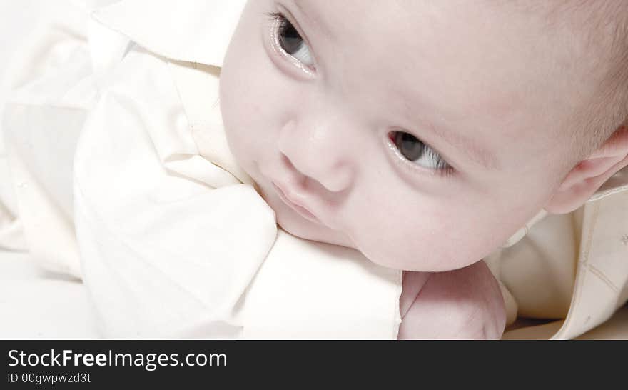 Little children portraits taken in the studio on a white background. Little children portraits taken in the studio on a white background