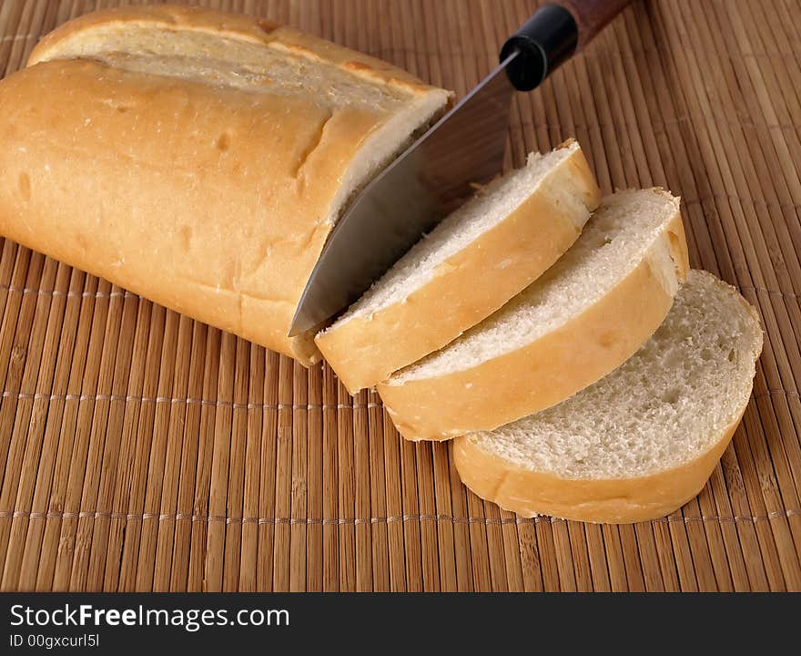 A loaf of French Bread on a place mat