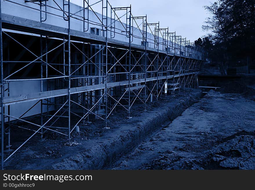 Scaffolding for a new parking lot under construction - blue monochrome. Scaffolding for a new parking lot under construction - blue monochrome