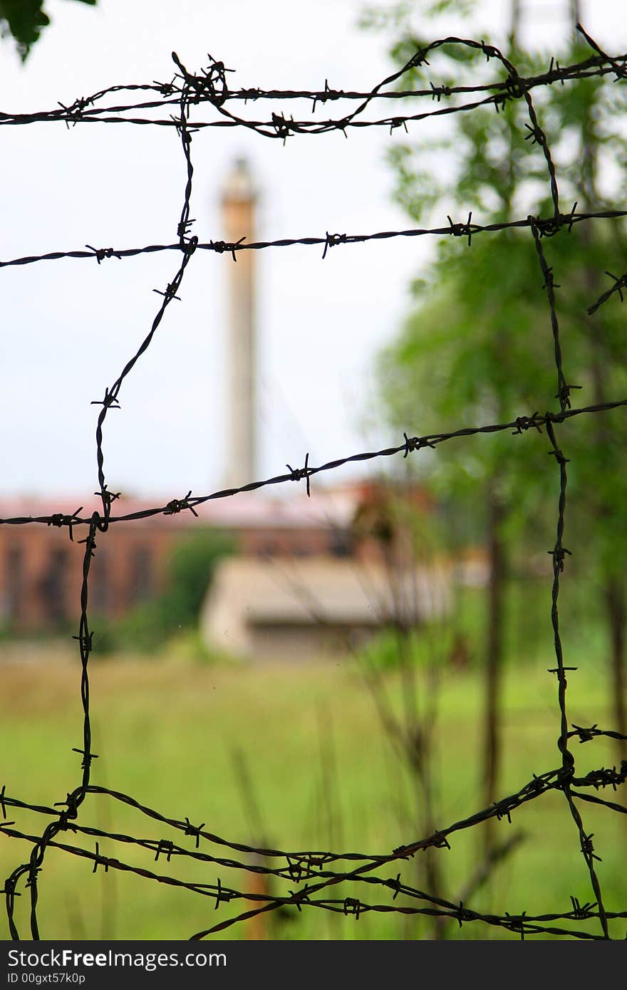 Factory behind barbed wire