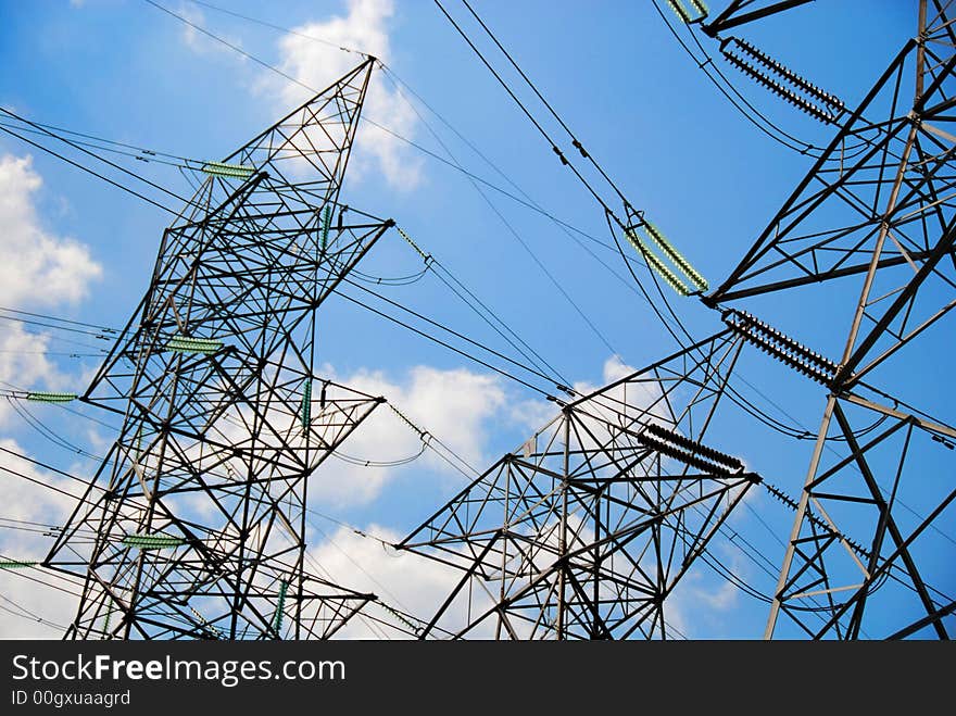 A group of high voltage tower in the blue sky. A group of high voltage tower in the blue sky