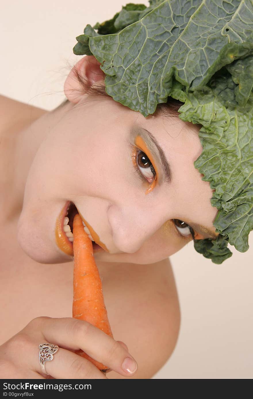 Girl with carrot and savoy cabbage hat