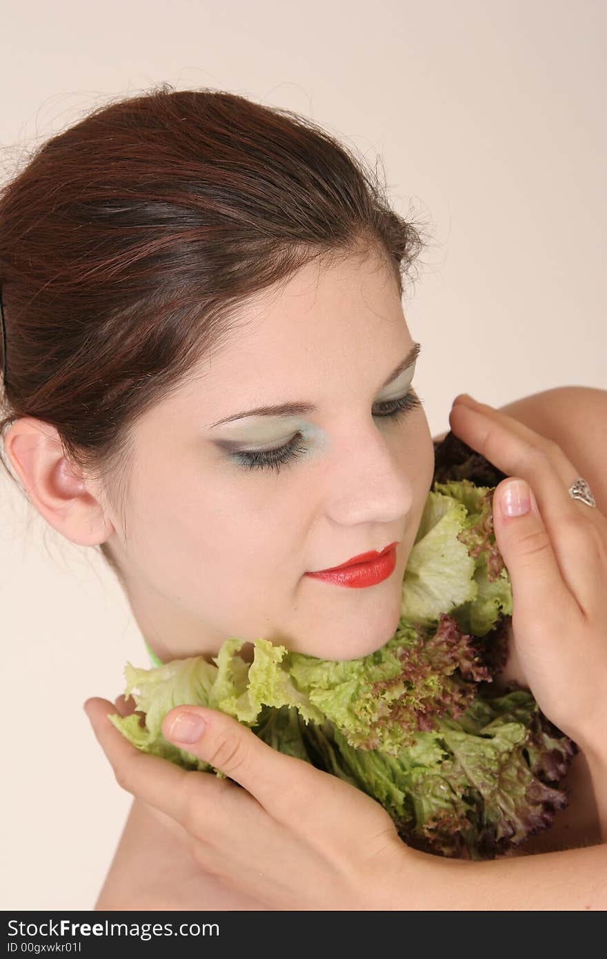 Lovely girl with hands at salad scarf. Lovely girl with hands at salad scarf