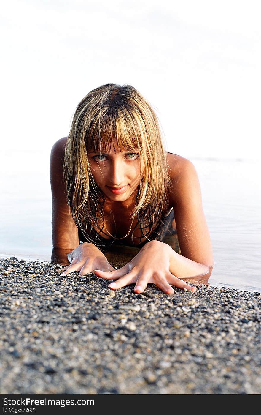 Portrait of beautiful girl relaxing at the sea. Portrait of beautiful girl relaxing at the sea.