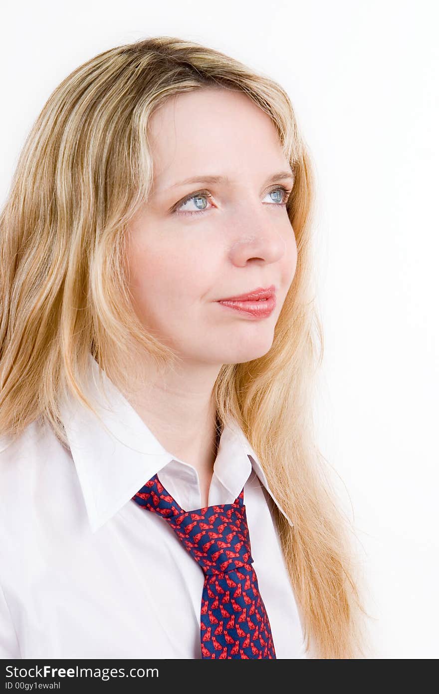 A pretty blond business woman wearing a shirt and tie