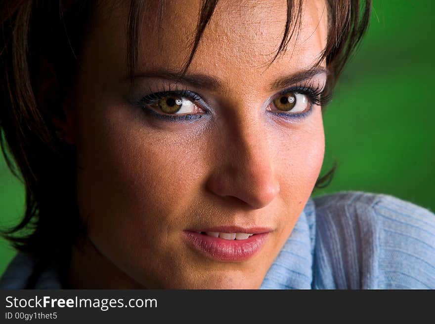 Close-up of a beautiful brunette with green eyes