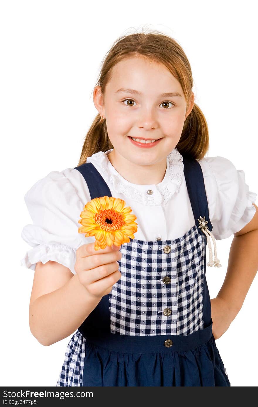 A pretty girl in a blue and white dress holding a yellow flower