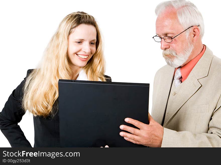 Two business associates looking at a laptop. Two business associates looking at a laptop