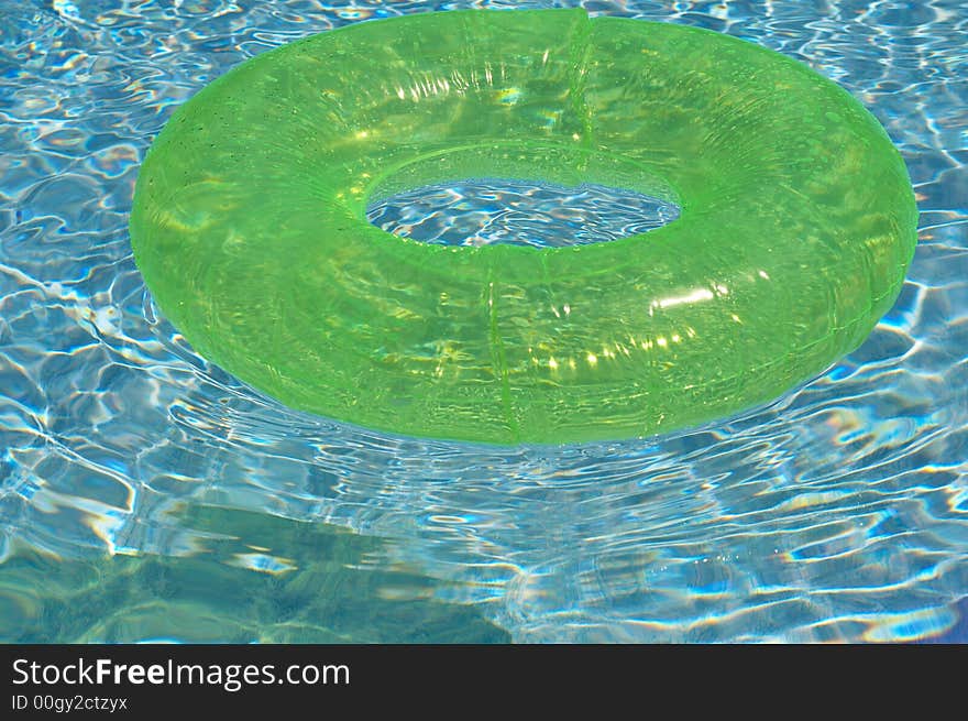 Round float in pool of water. Round float in pool of water