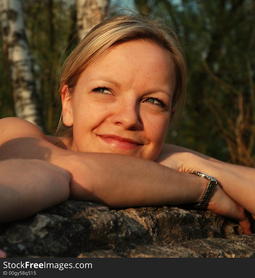 Sunbathing young woman is enjoying the summer. Sunbathing young woman is enjoying the summer