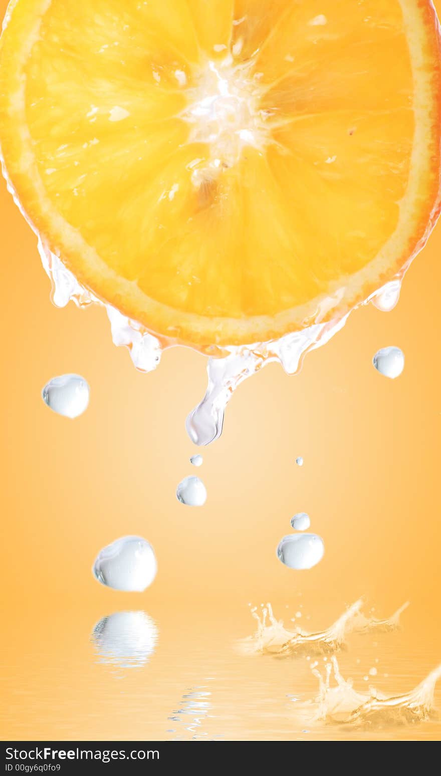 Fresh orange with a big drops falling in a juice sea. Fresh orange with a big drops falling in a juice sea.