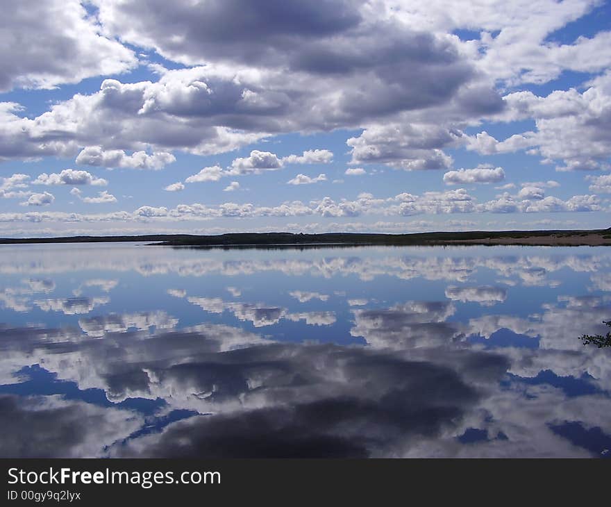 Clouds reflected off the calm lake. Clouds reflected off the calm lake.